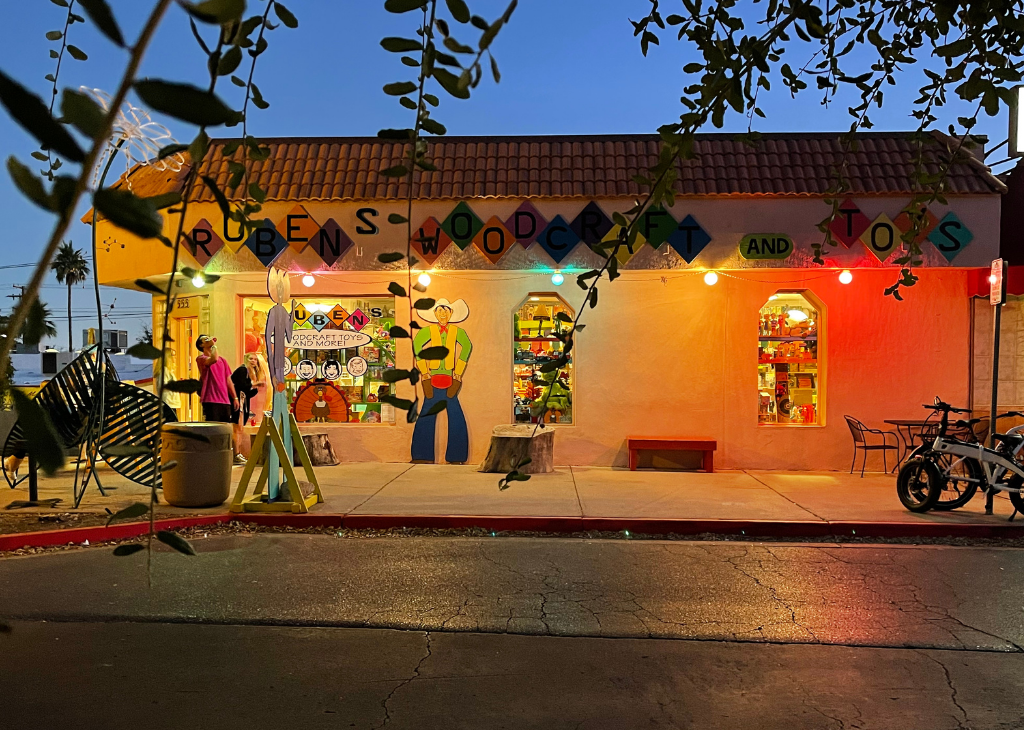 Toy store with window an woods crafted life size cowboy