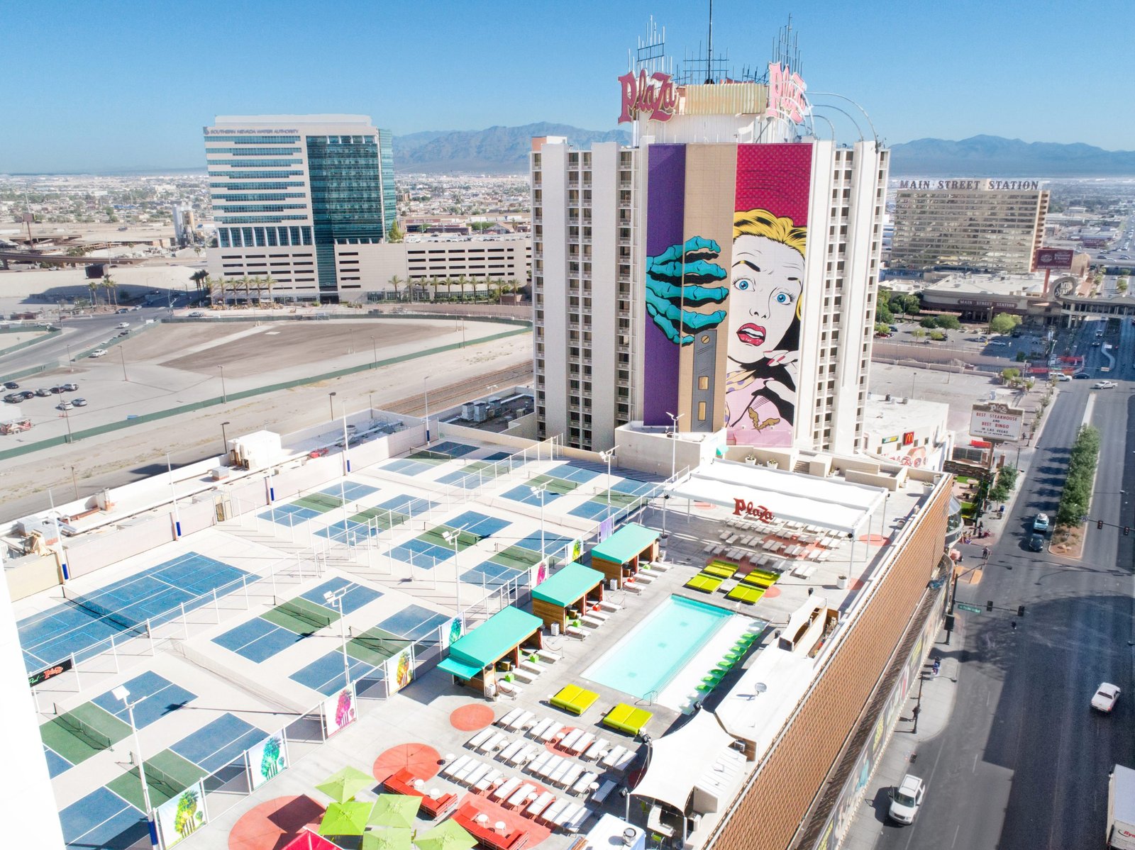 An ariel shot looking into plaza pool and hotel tower.
