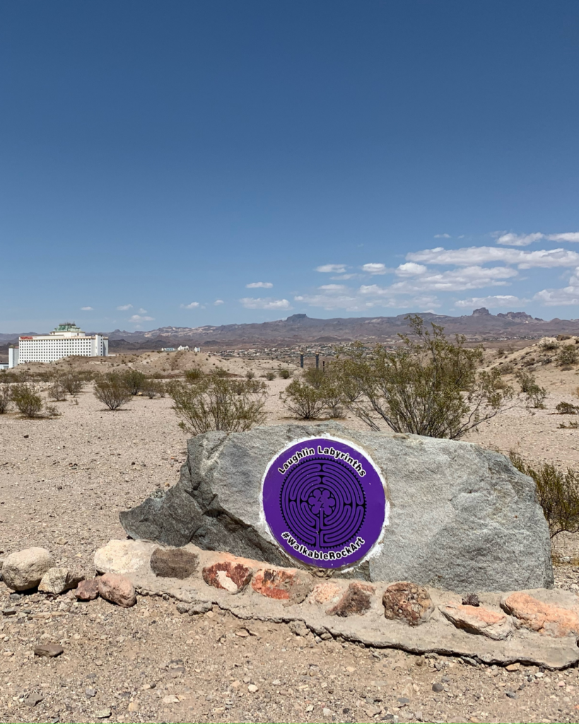 A rock with a purple circle sign to designate you arrived at the labyrinths