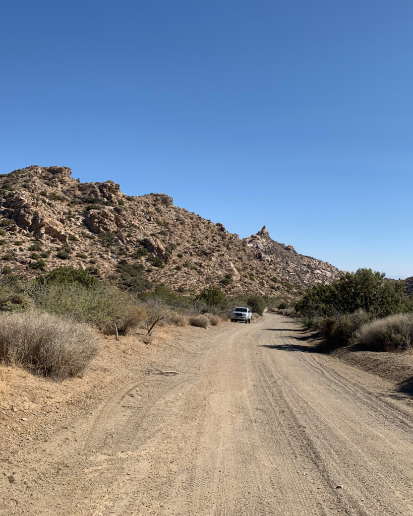 A truck on the dirt road of Christmas Tree Pass