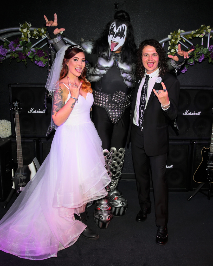 A couple getting married by KISS impersonator