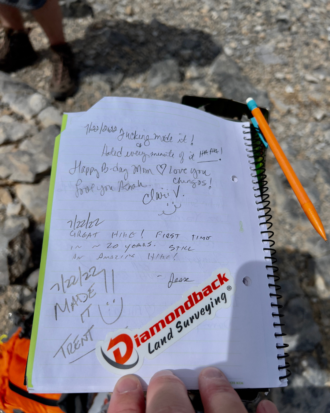 A view from a UTV looking at two UTVs kicking up dust at Adrenaline Mountain in Goodsprings
