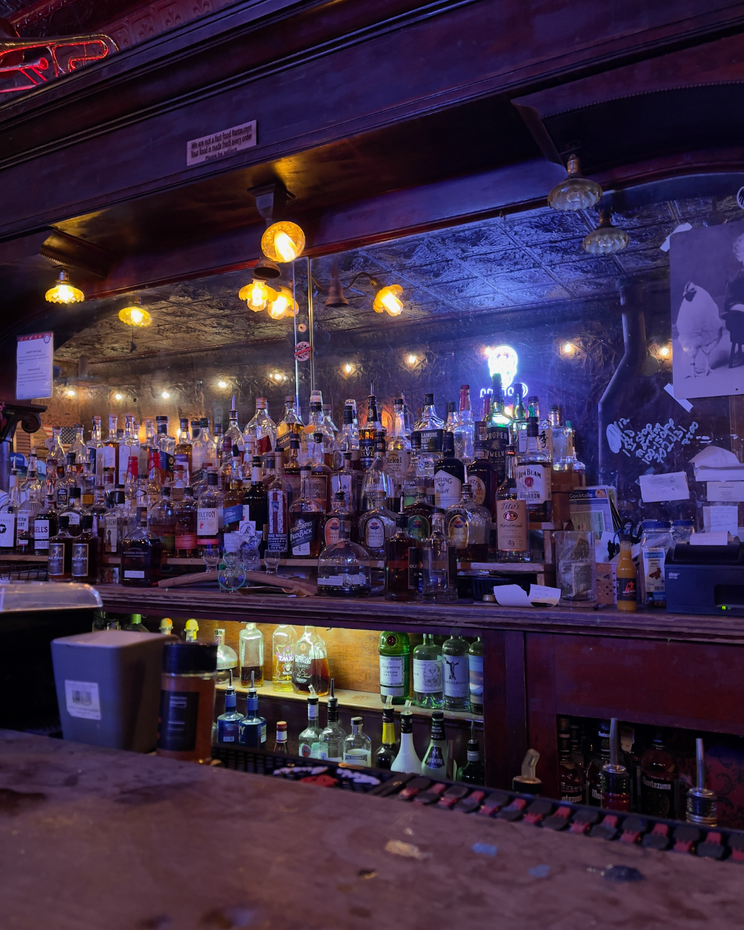 A view of the Pioneer Saloon bar area with the original bar top peeking out of the bottom pic