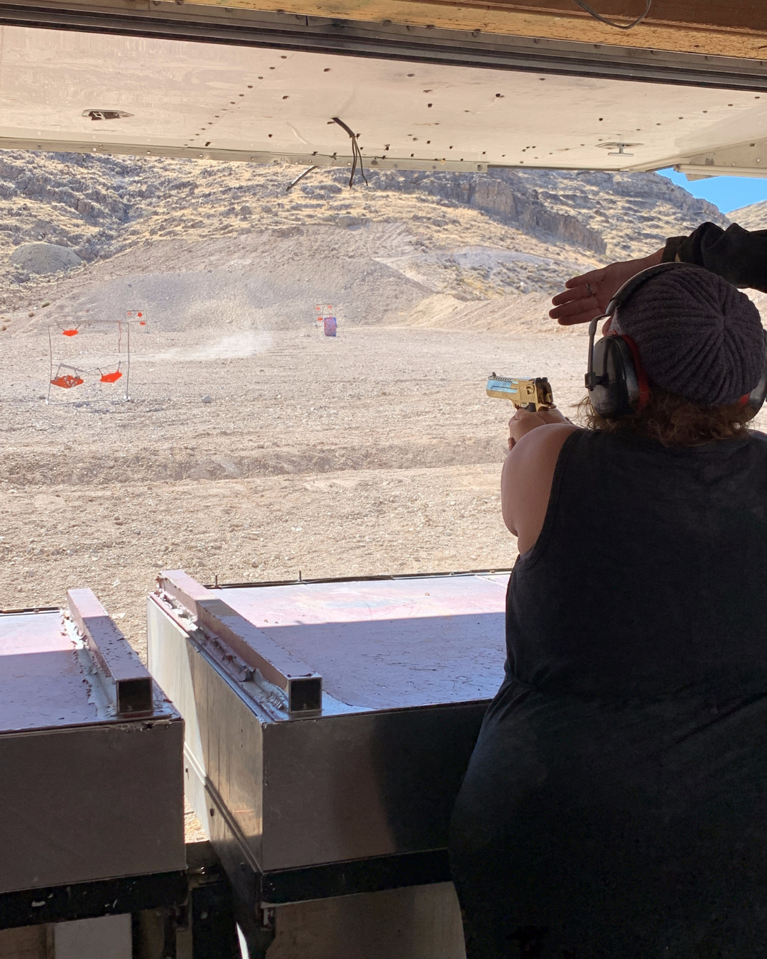 A woman shooting the The Goldmember from Austin Powers in Goldmember