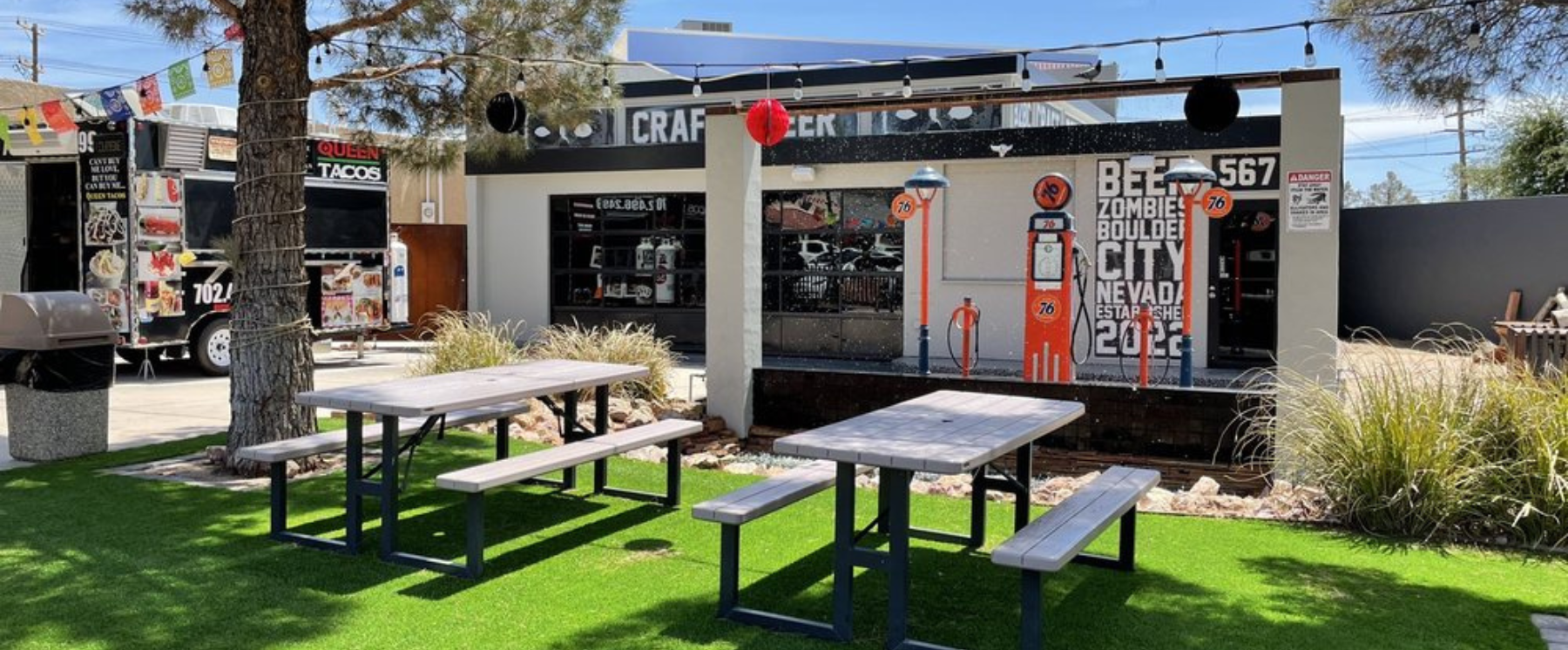 A sunny day in Boulder City looking at a picnic area in the back of Beer Zombie