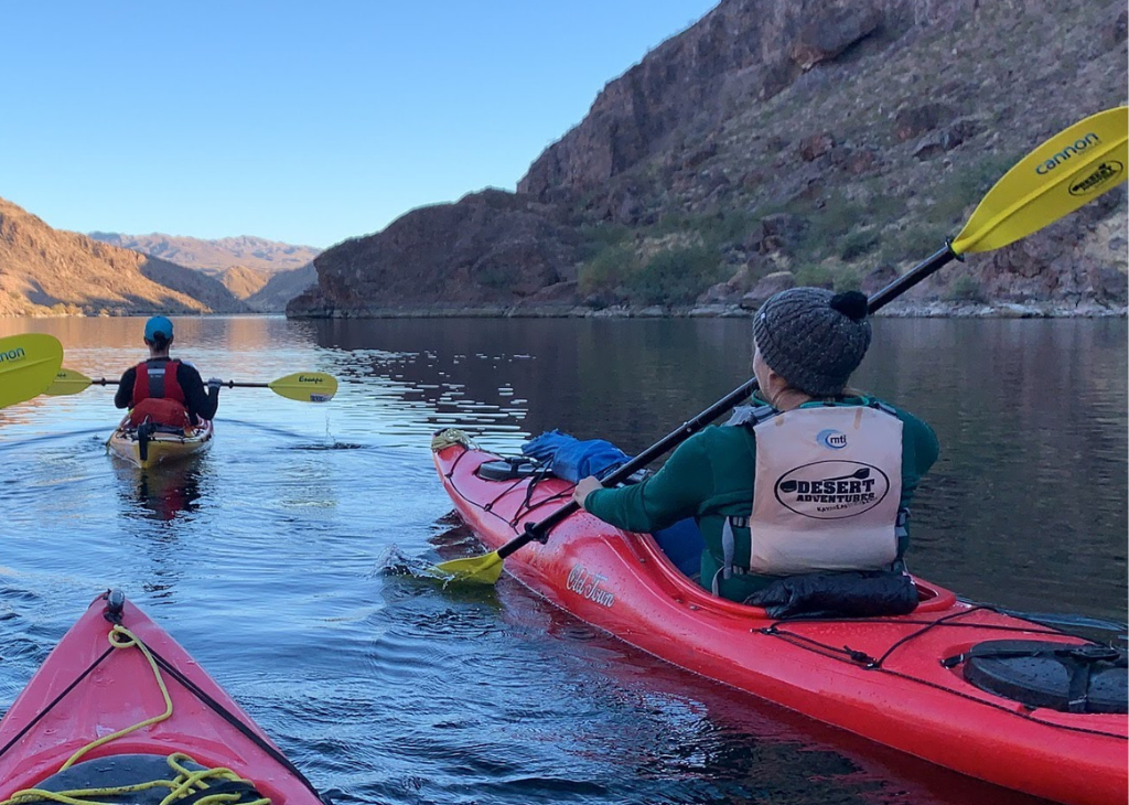 Two people kayaking down the Colorado River outside of Boulder City