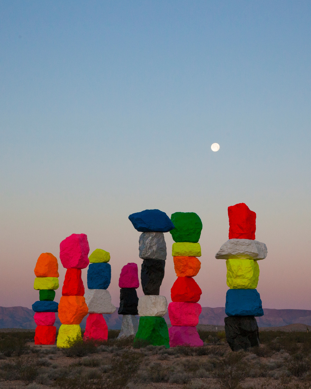 A full moon and dusk sky viewing 7 colorful rock art formations