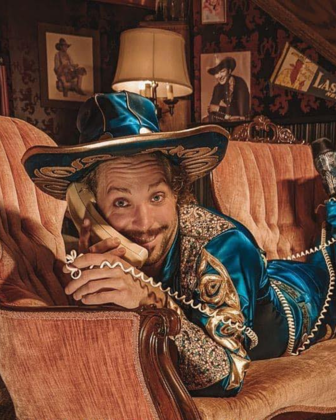 A character laying on a couch holding a phone