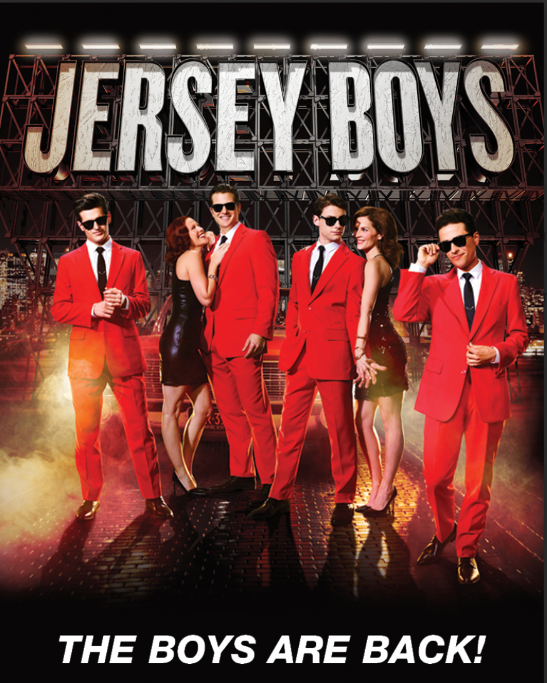 Jersey Boys ad shoot: the guys in red suits flanking a girl in a black dress.