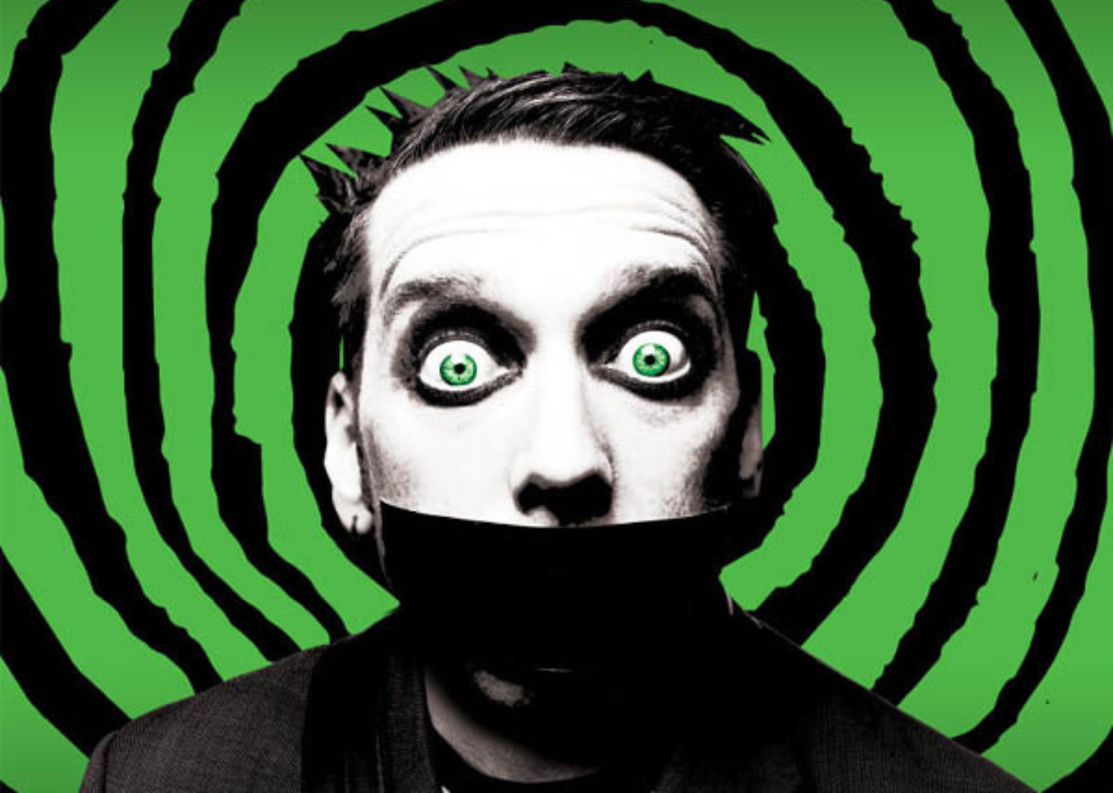 A green and black circle with the tape face character bugging his emphasized green eyes out.