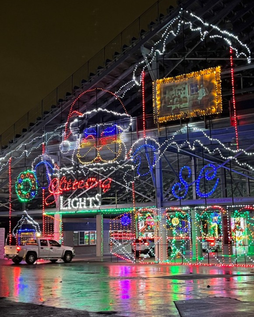 glittering lights at the las vegas motor speedway entrance into the first tunnel of lights with a giant santa and spirit o meter.