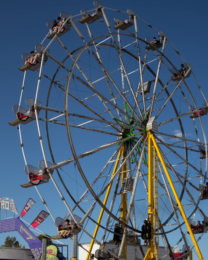 A big ferris wheel at Clark County Fair & Rodeo with blue clear skys. Event is in Moapa Valley about hour from Las Vegas.