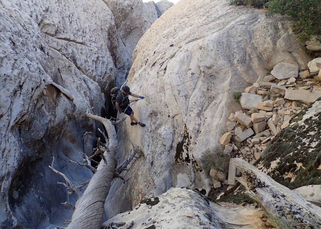 Cody Lewis is canyoneering.
