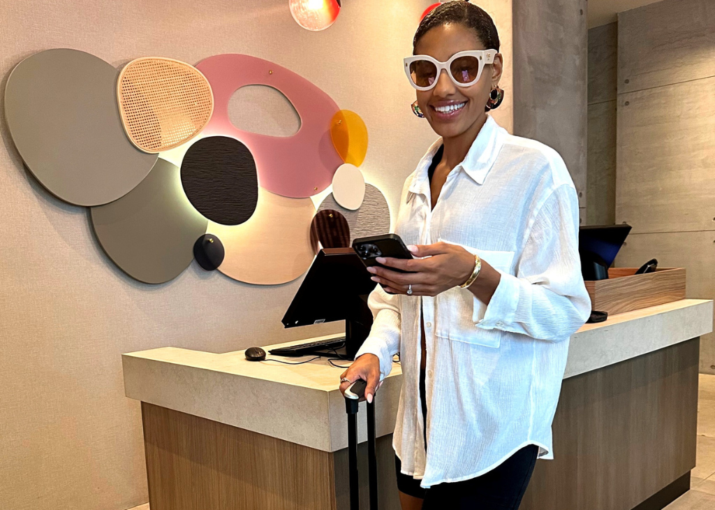 Atwell Suites at the Pass and a women is at check-in.