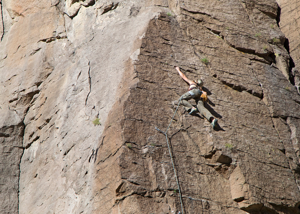 A female climbs Rainbow Canyon. Located directly south of the community of Caliente. Travel Nevada