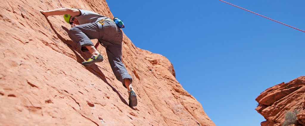 Travel Nevada photo of a person climbing at Red Rock Canyon.