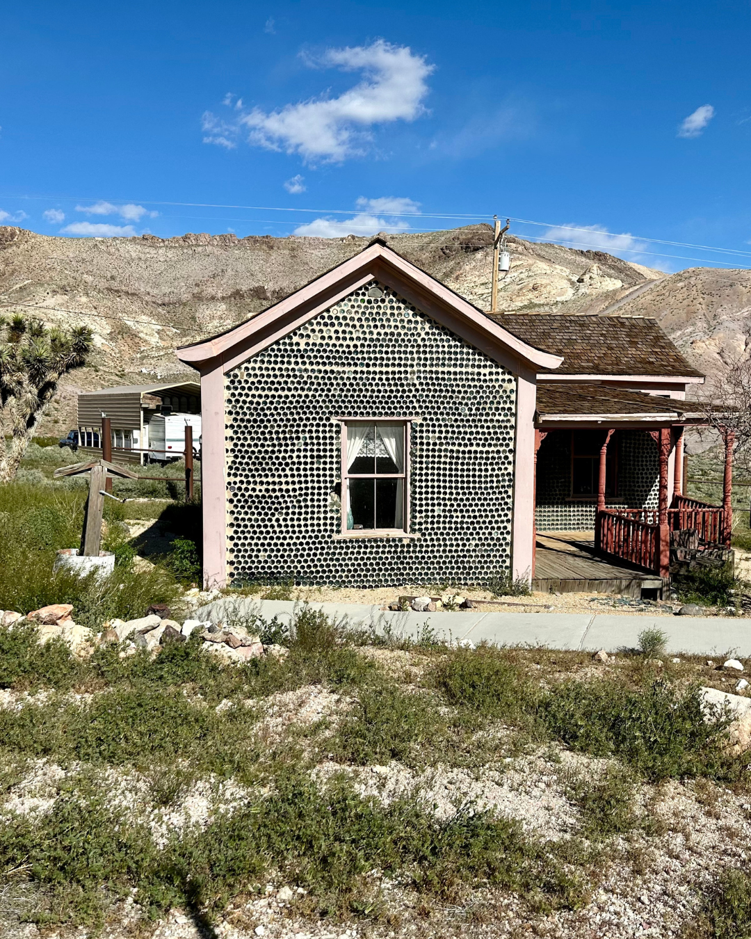 In this pic we are road tripping to Rhyolite Ghost Town for a shot of the the Tom Kelly Bottle house on a beautiful blue sky, light cloud day.