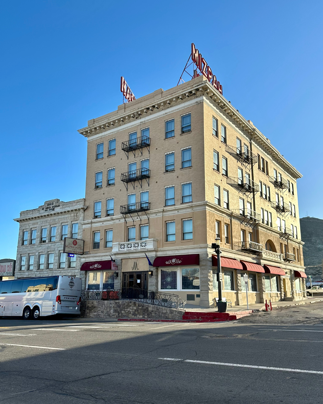 Road tripping to Tonopah to stay at the haunted Mizpah Hotel in the picture on a bright blue skyed day.