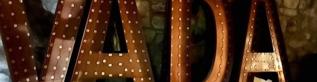 Old giant letters from the Belvada sign in the basement of the hotel. Letters depicted show VADA which means knowledge....if only the author new there were ghosts were she was staying...