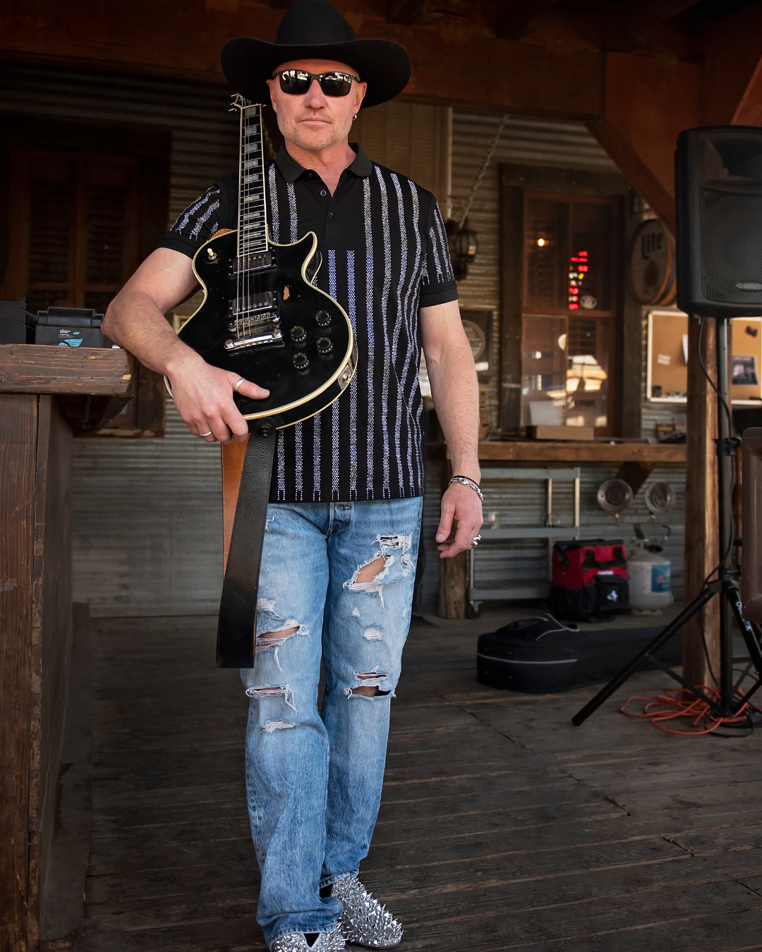 Old Man Liver and his guitar at Pioneer Saloon.