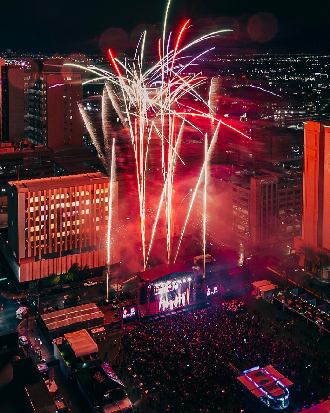 Downtown Las Vegas Events Center is the host of many sports watch events and concerts. This shot is looking down on the entire complex with a crowd and fireworks.