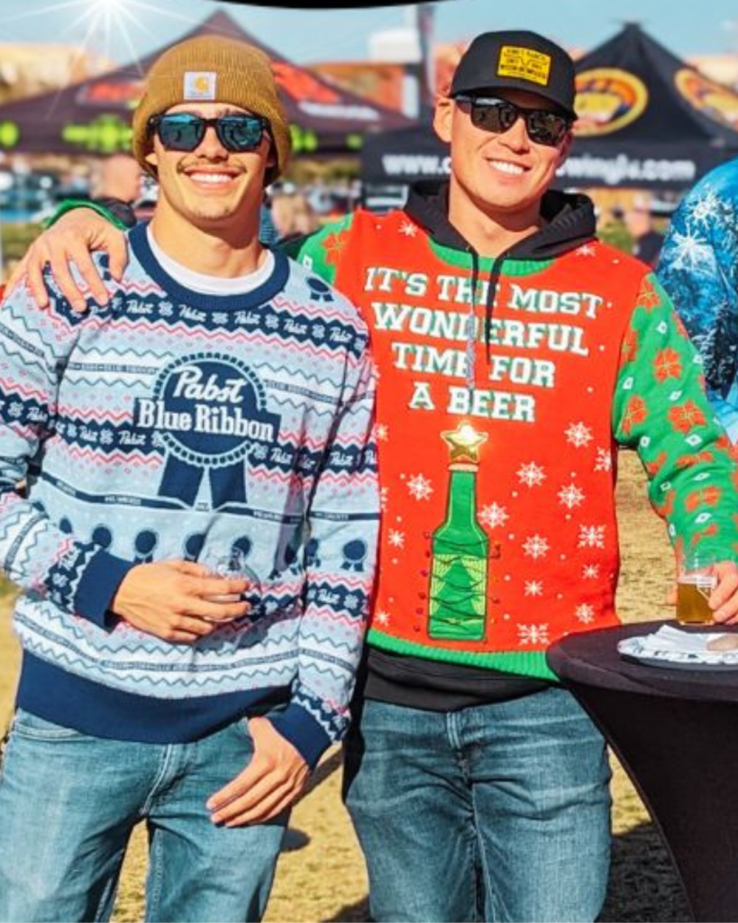 Nevada Brewery Association's Brew Festivus in Henderson. Pictured: two guys in holiday sweaters.
