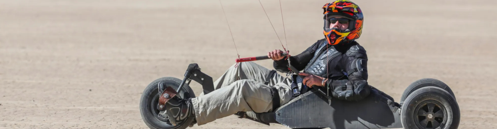 Man Riding a Kite on a Dirt Road in Las Vegas Territory