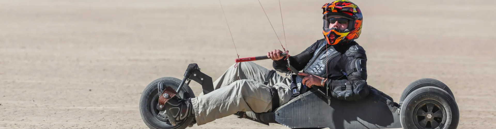 Man Riding a Kite on a Dirt Road in Las Vegas Territory