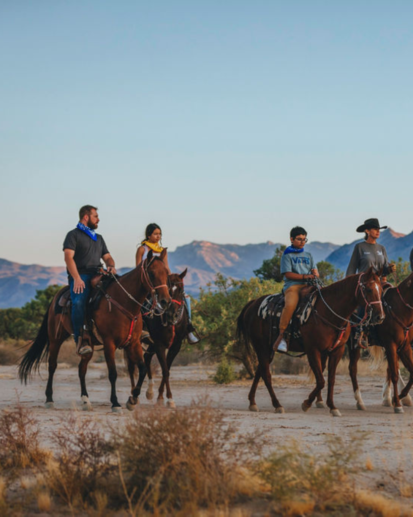 A group on horses at Sandy Valley Ranch 45 minutes from Las Vegas Strip.
