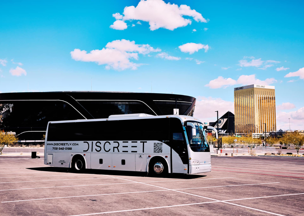 A Discreet Transportation Bus by Allegiant Stadium with Mandalay Bay in the backgrounds.