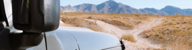 A jeep stopped at a fork in the road in southern Nevada.