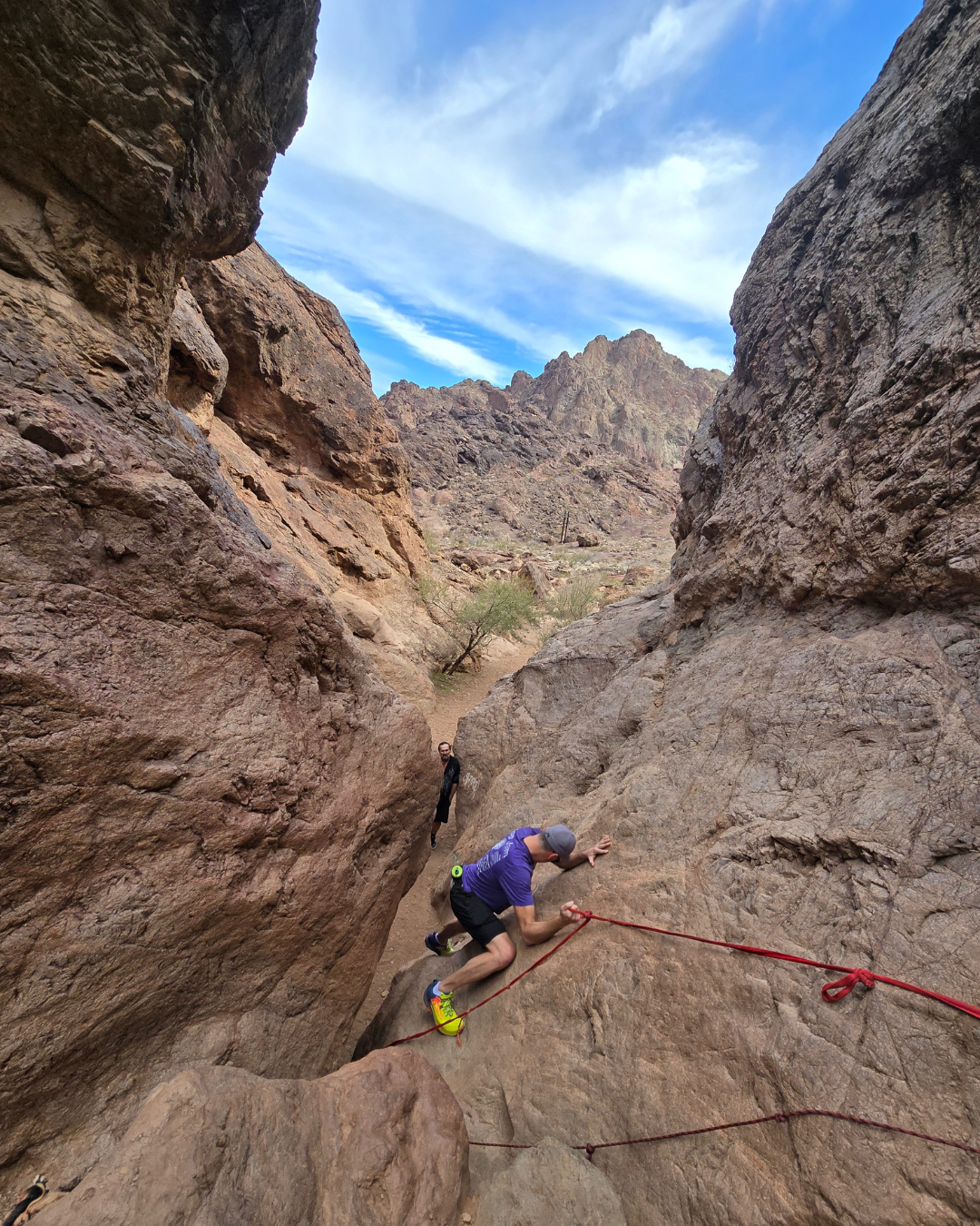 A person on a rope going down the Goldstrike Canyon Trail which is closed seasonally - typically May through September.