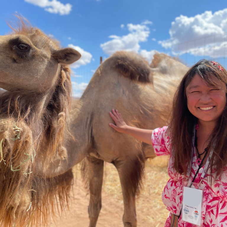 A business travel event at Camel Safari and this female poses with a camel on the outing.