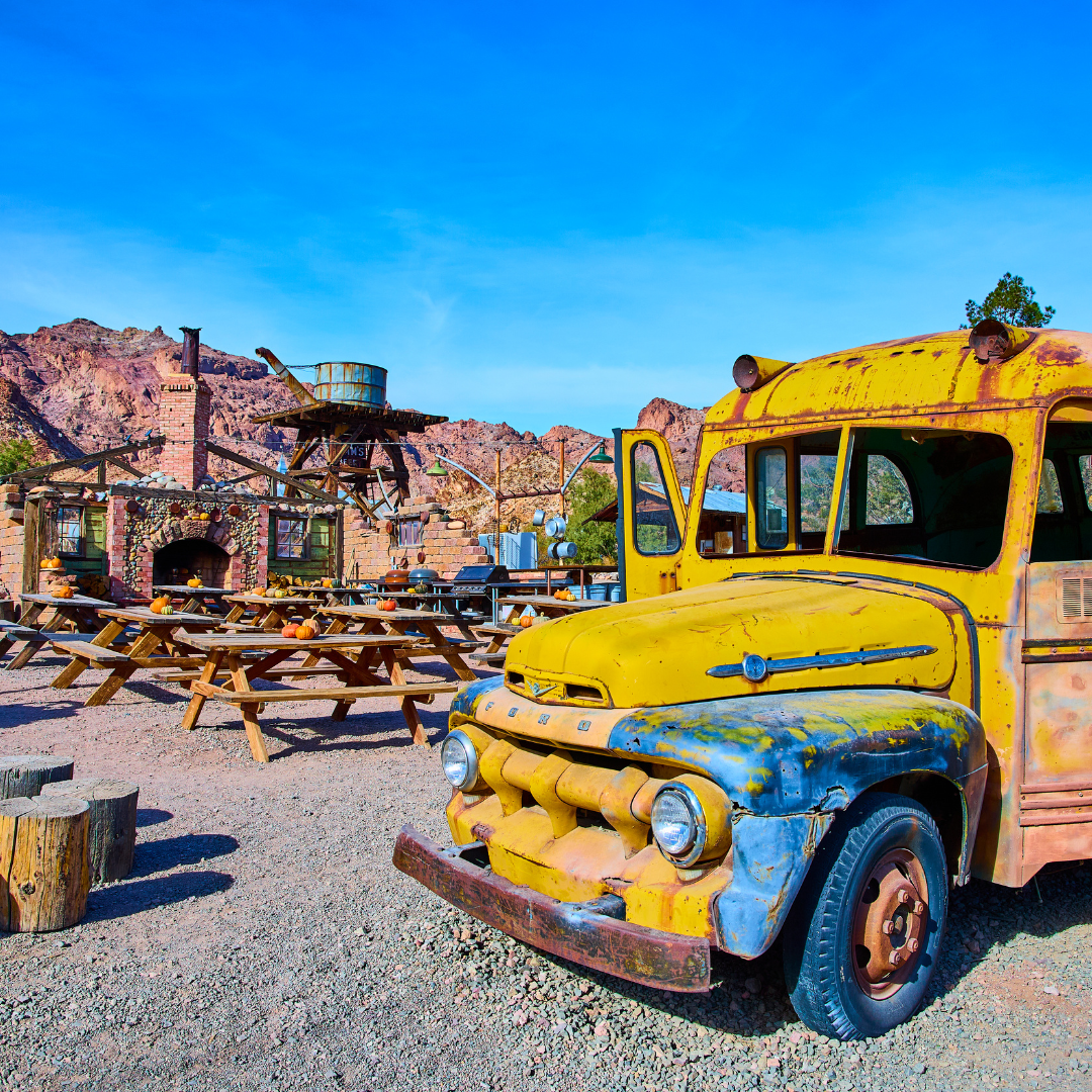 Destination Henderson Nevada. Nelson Ghost Town is a short drive and photo shows picnic tables and old school bus.