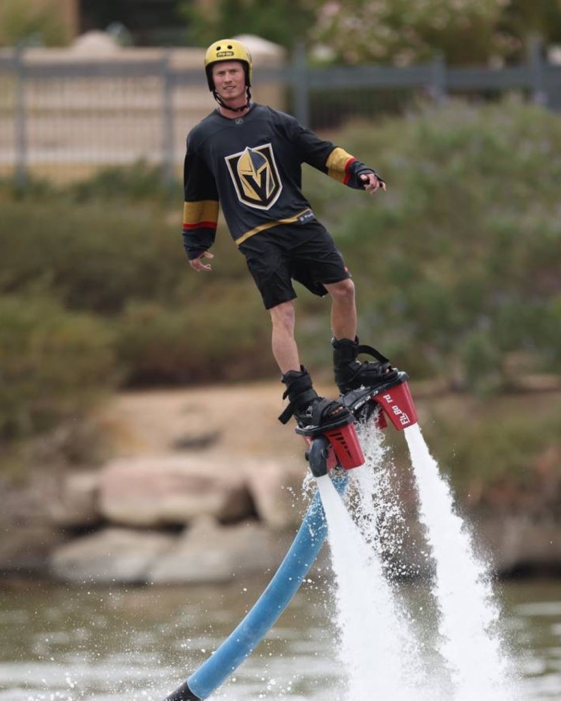A person wearing a Vegas Golden Knights jersey on a jet pack at Lake Las Vegas, which is just a short drive from Henderson Nevada.
