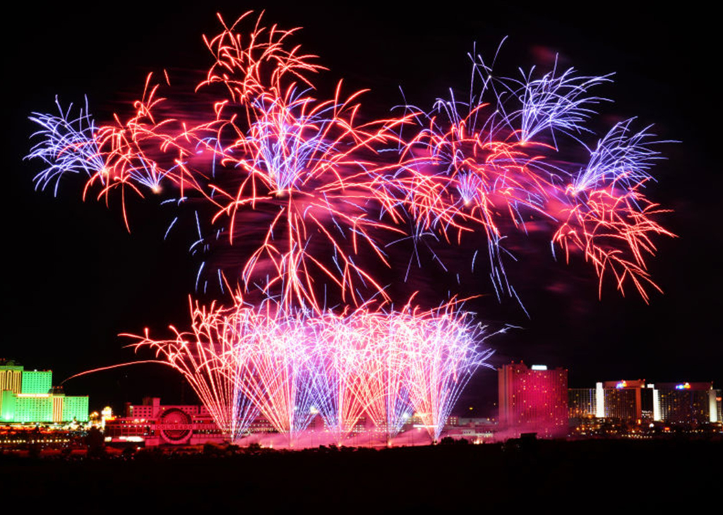 Pink Orange Purple fireworks over the Colorado River in Laughlin